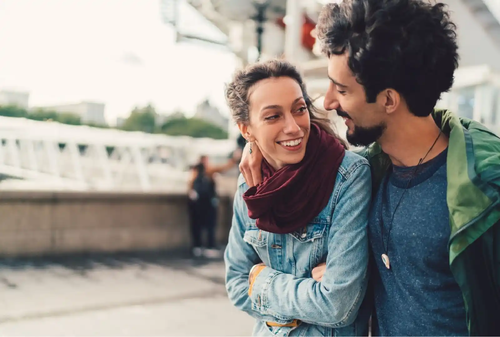 Personal Immigration - Young foreign couple walking and smiling together